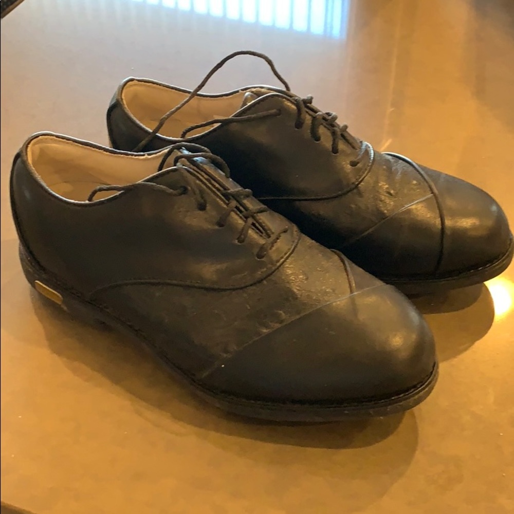 Women’s Footjoy black leather golf shoes.